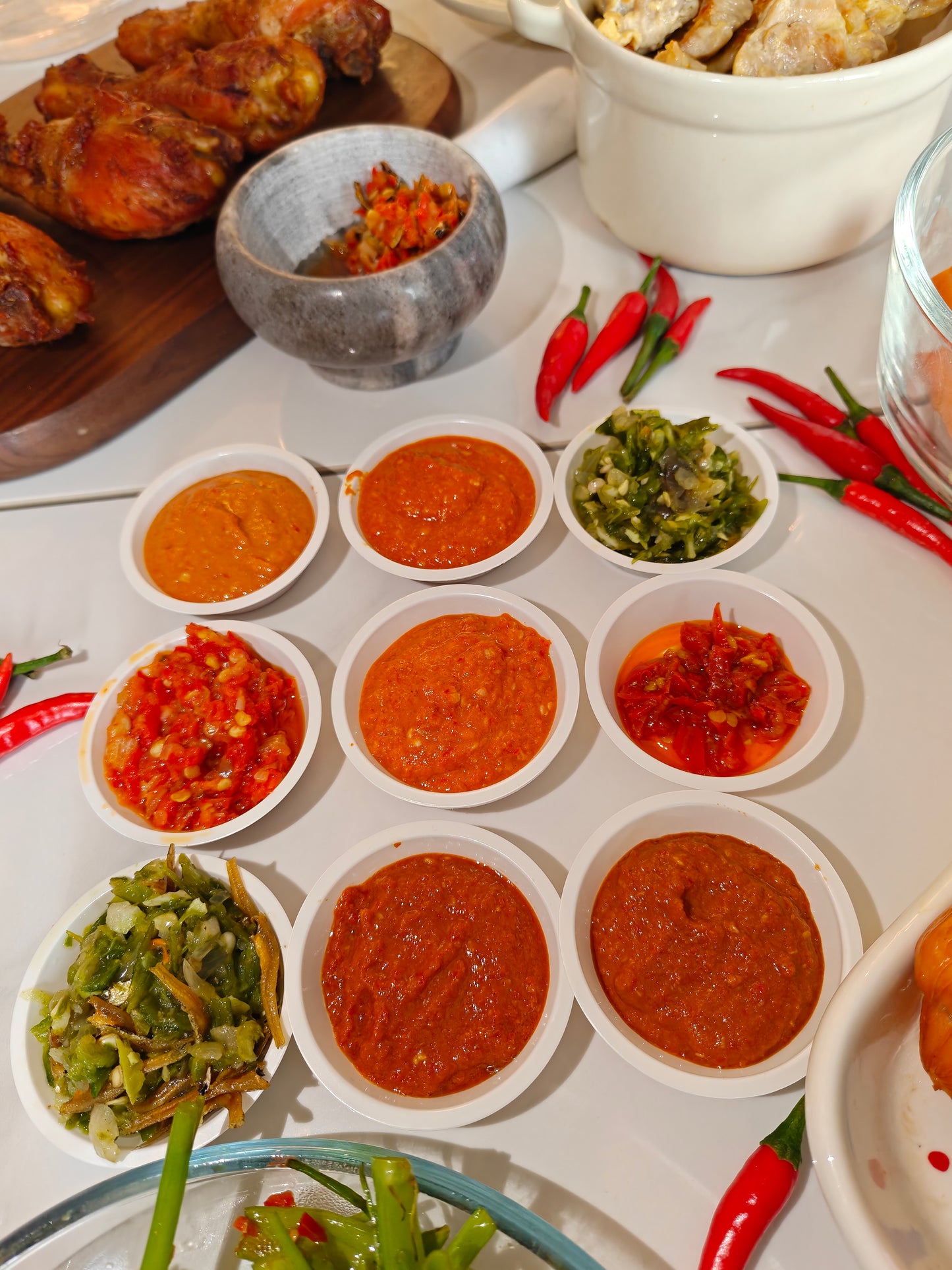 serving suggestions for Old Flame chili sauce Singapore pairs with dumplings, chicken rice, noodles, mala chili, sambal chili paste, and Indo chili dishes