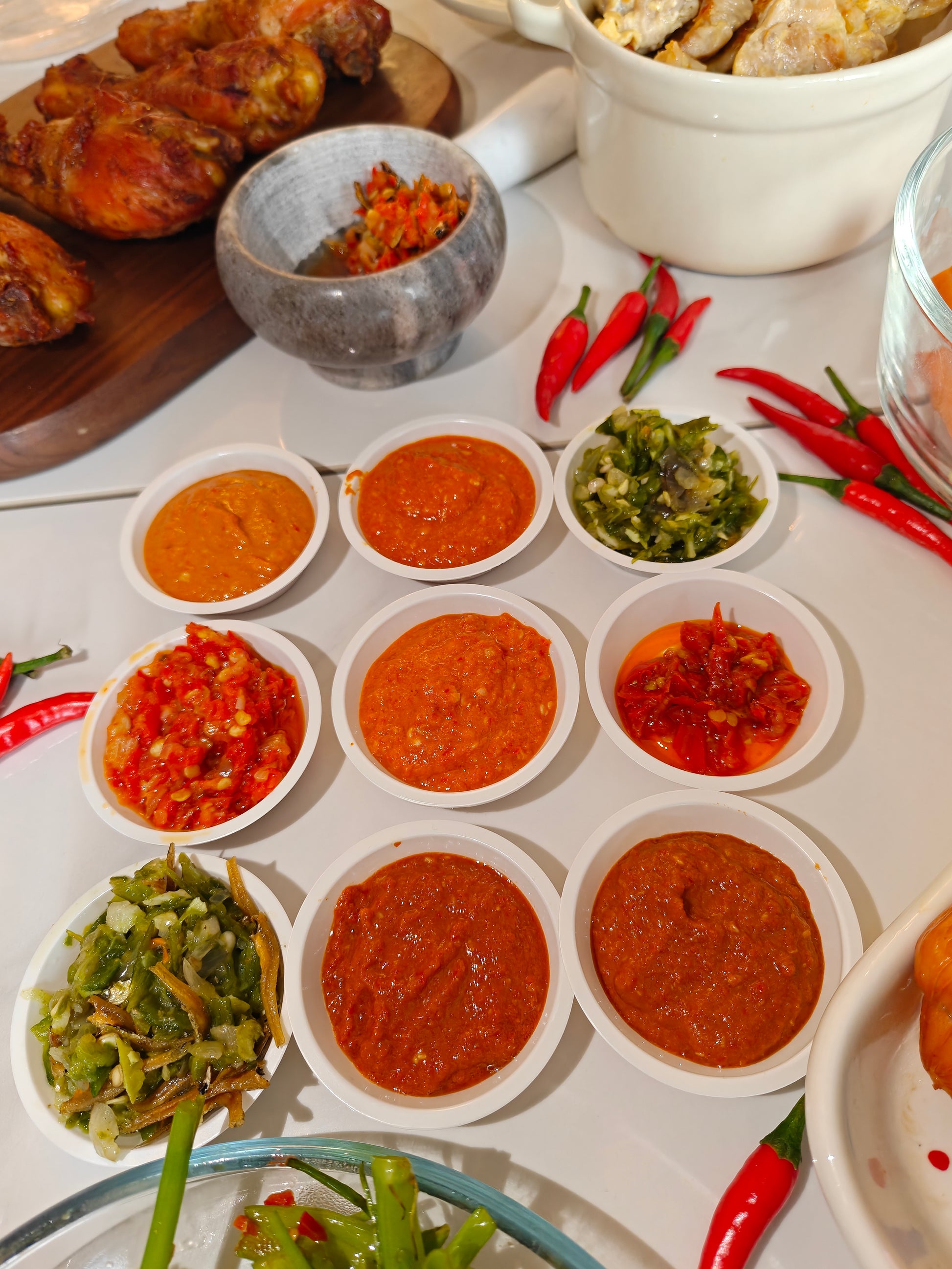 serving suggestions for Old Flame chili sauce Singapore pairs with dumplings, chicken rice, noodles, mala chili, sambal chili paste, and Indo chili dishes 