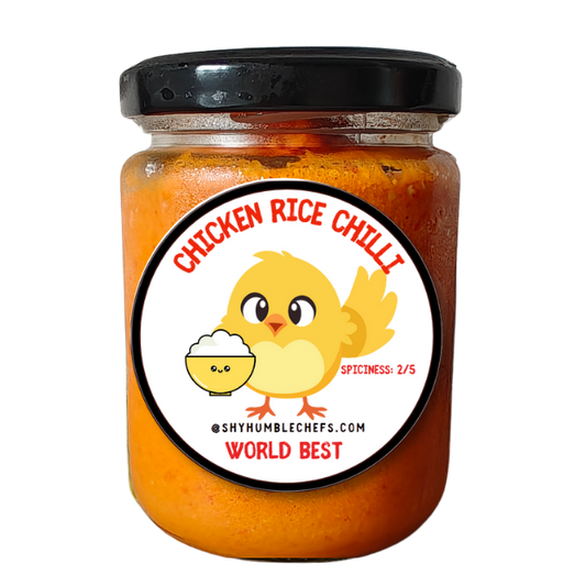 Jar of Chicken Rice Chili – handcrafted garlic chilli sauce from Singapore, perfect pairing with Hainanese chicken rice. Labeled spiciness 2/5 with cute chicken rice mascot.